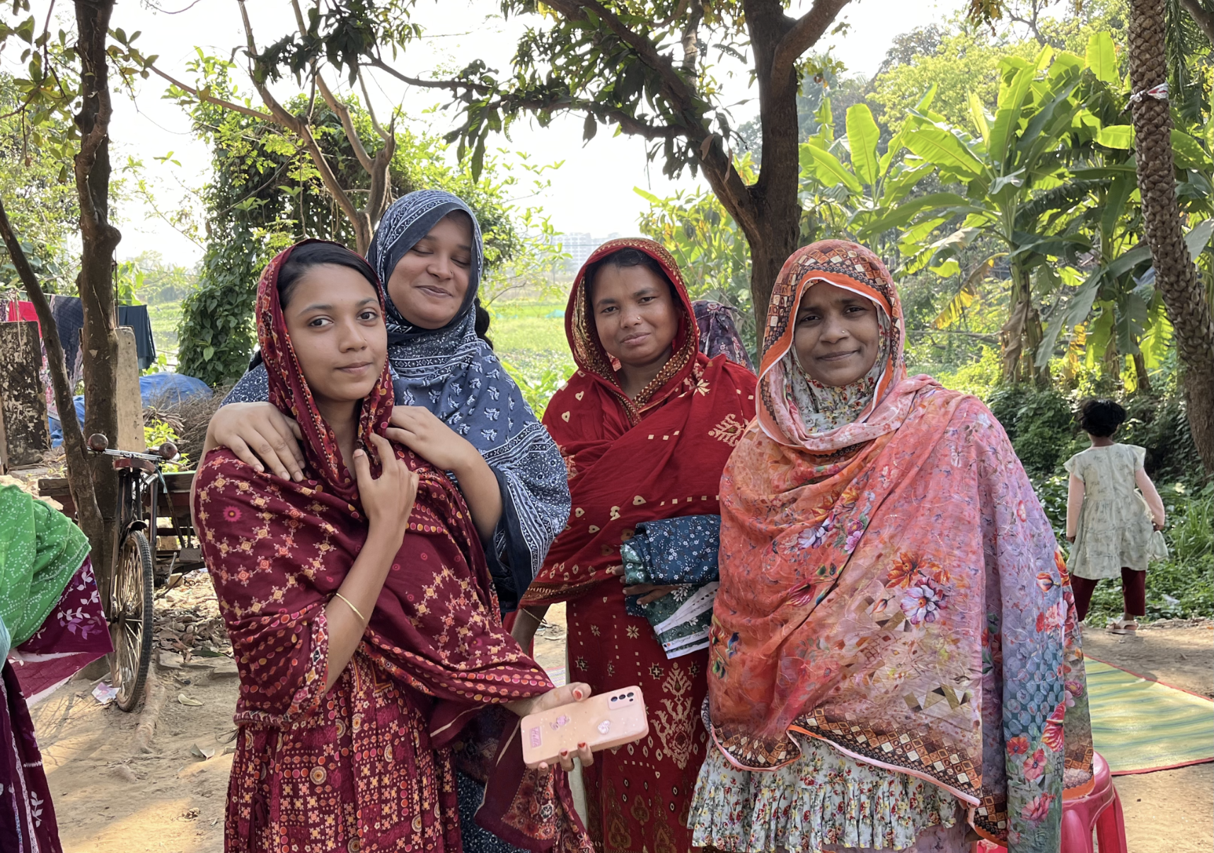 Women wait to see a medical mobile clinic